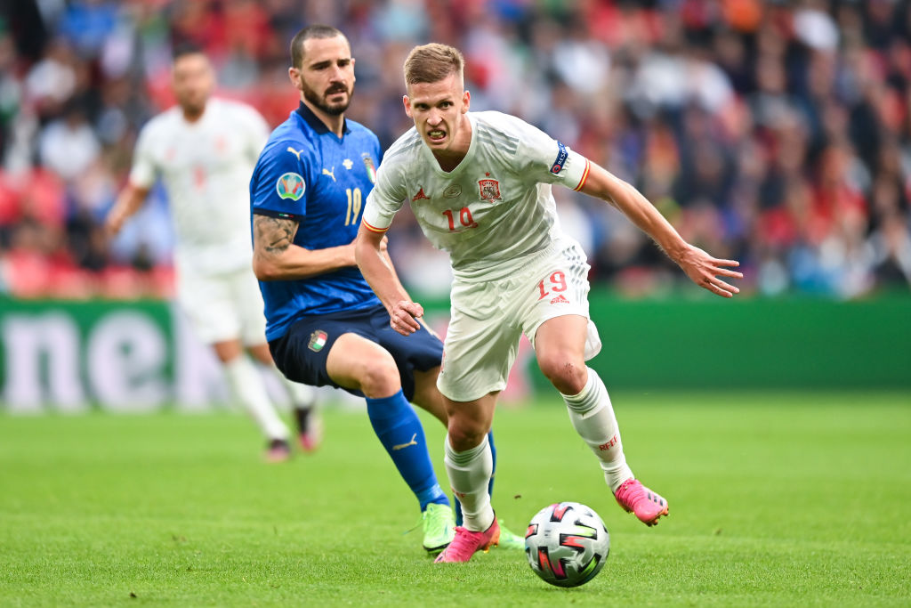 Dani Olmo of Spain looks to break away from Leonardo Bonucci of Italy during the UEFA Euro 2020 Championship Semi-final match between Italy and Spa...