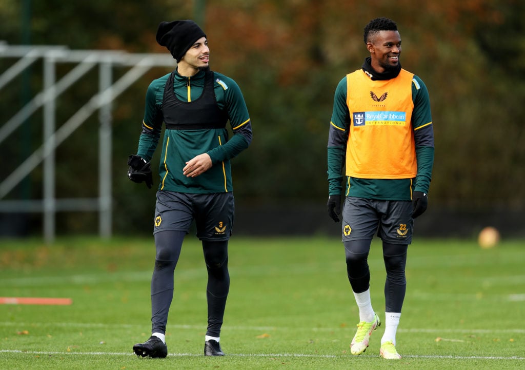 Rayan Ait-Nouri (L) and Nelson Semedo of Wolverhampton Wanderers look on during a Wolverhampton Wanderers Training