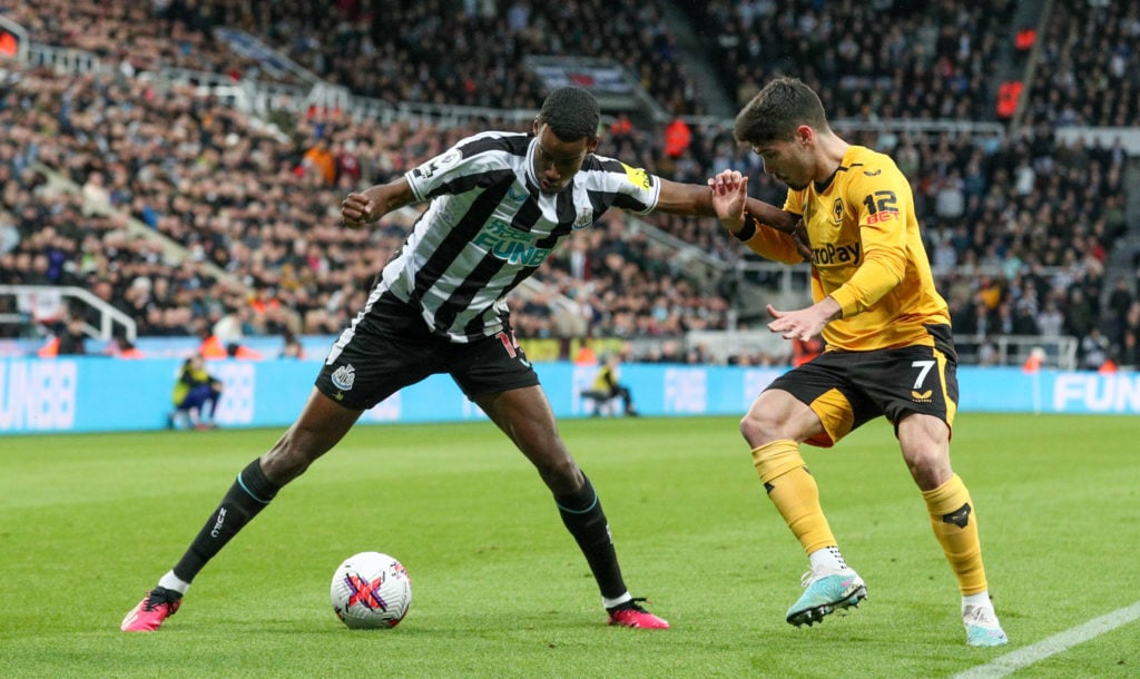 Newcastle United's Alexander Isak battles with Wolverhampton Wanderers' Pedro Neto during the Premier League match