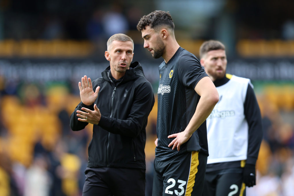 Gary O'Neil, Manager of Wolverhampton Wanderers, speaks with Max Kilman of Wolverhampton Wanderers during the warm up prior to the Premier League m...