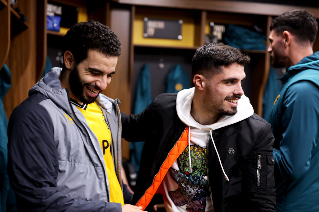 Rayan Ait-Nouri (L) and Pedro Neto of Wolverhampton Wanderers celebrate victory in the dressing room following the Premier League match between Wol...