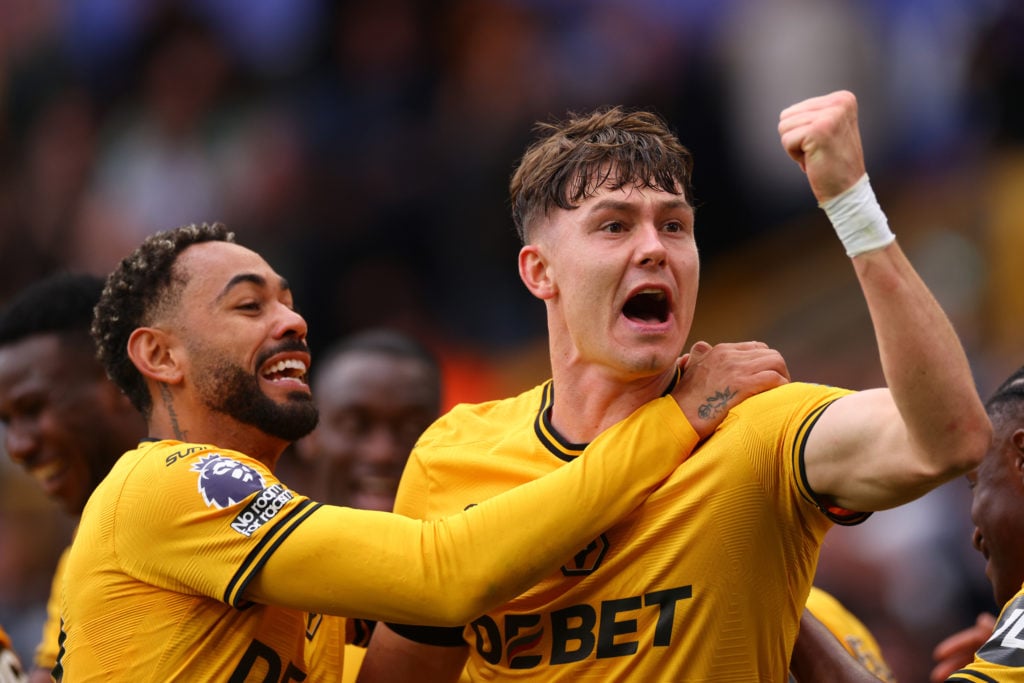 Jorgen Strand Larsen of Wolverhampton Wanderers celebrates scoring their second goal with Matheus Cunha during the Premier League match between Wolverhampton Wanderers FC and Chelsea FC at Molineux on August 25, 2024 in Wolverhampton, England