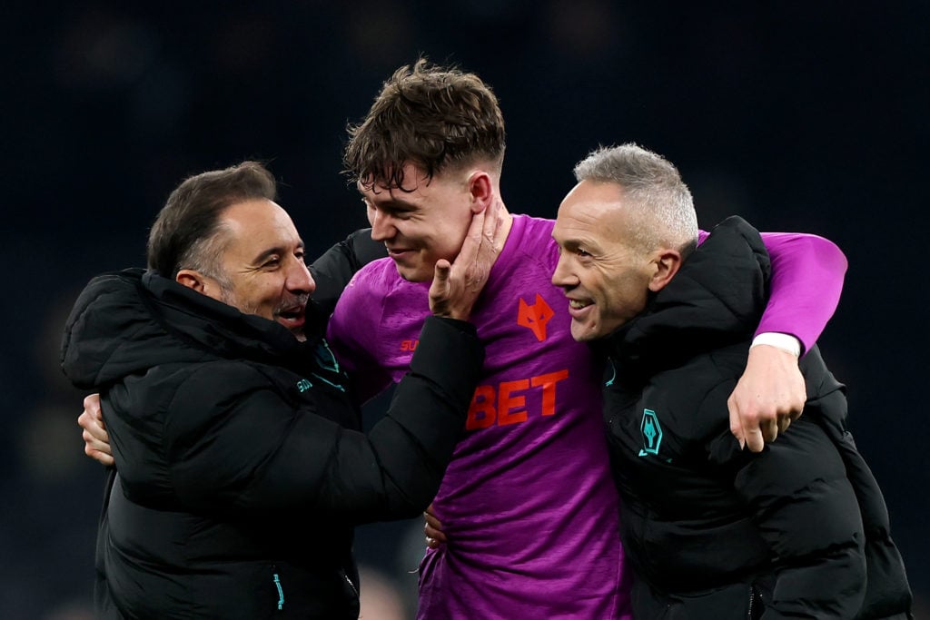 Vitor Pereira, Manager of Wolverhampton Wanderers, and Andre Monteiro, Assistant Manager of Wolverhampton Wanderers, embrace Joergen Strand Larsen of Wolverhampton Wanderers after the draw in the Premier League match between Tottenham Hotspur FC and Wolverhampton Wanderers FC