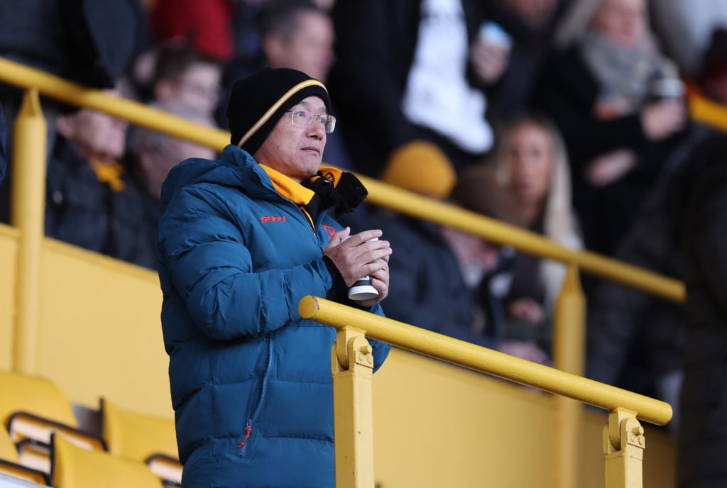 Fosun looks on before Wolves vs Arsenal