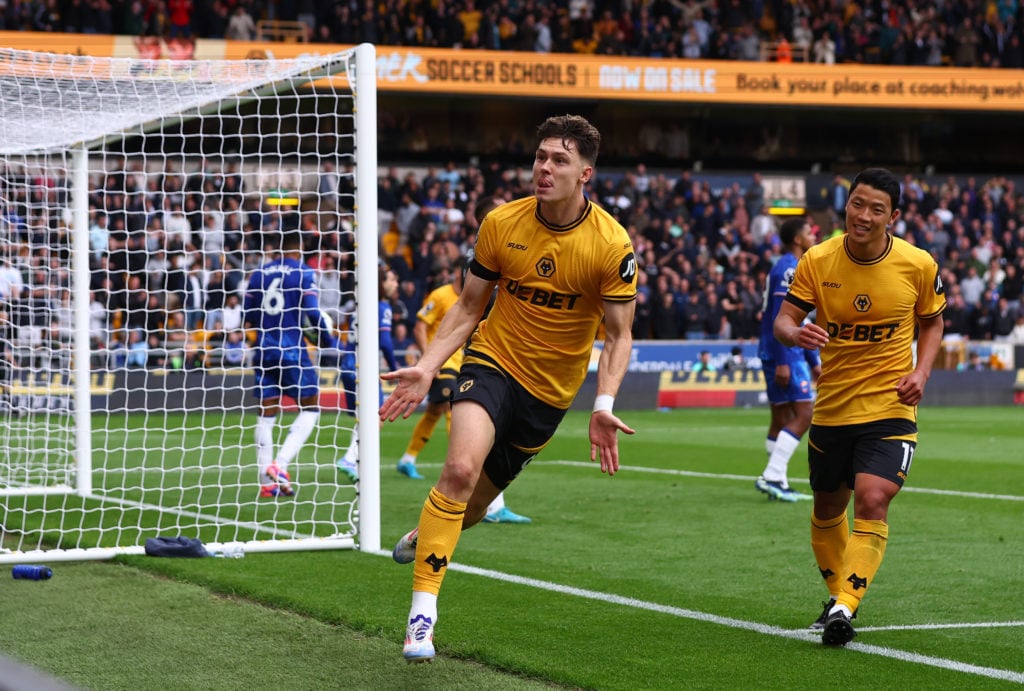 Jorgen Strand Larsen of Wolverhampton Wanderers celebrates scoring their second goal with Hwang Hee-chan during the Premier League match between Wolverhampton Wanderers FC and Chelsea FC at Molineux on August 25, 2024 in Wolverhampton, England