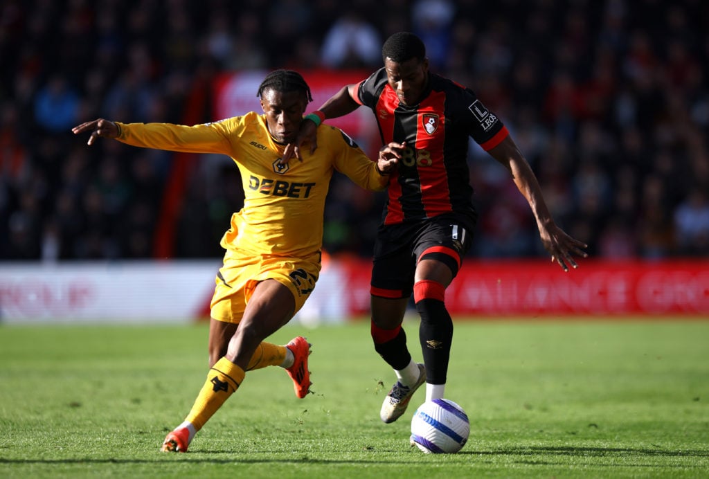 Jean-Ricner Bellegarde of Wolverhampton Wanderers battles for possession with Dango Ouattara of AFC Bournemouth during the Premier League match between AFC Bournemouth and Wolverhampton Wanderers FC