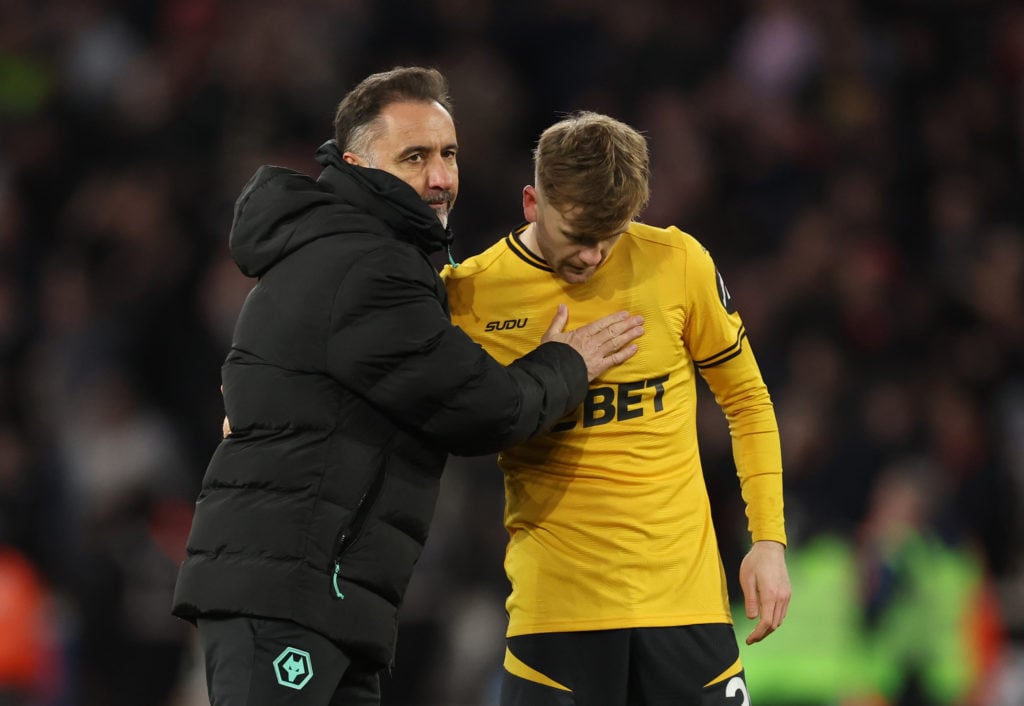 Vitor Pereira embraces Tommy Doyle after the Premier League match between Wolves and Arsenal.