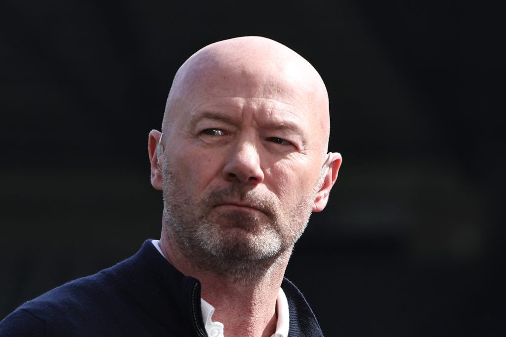 Alan Shearer looks on.
