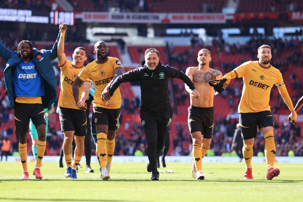 Wolverhampton Wanderers manager Vítor Pereira celebrates victory with his players after the Premier League match between Manchester United FC and Wolverhampton Wanderers FC