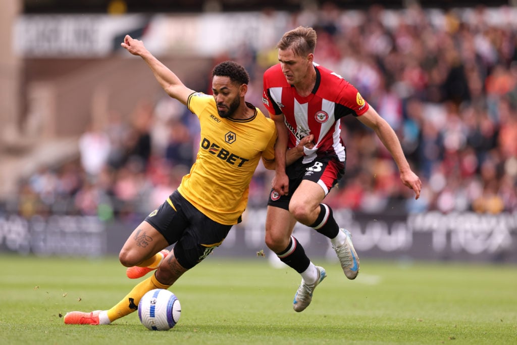 Matheus Cunha jostles for possession for Wolves against Brentford.