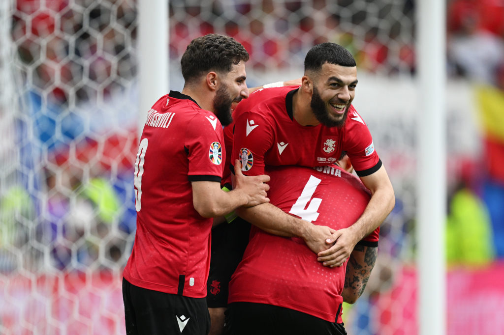 Georges Mikautadze celebrates with his Georgia teammates.