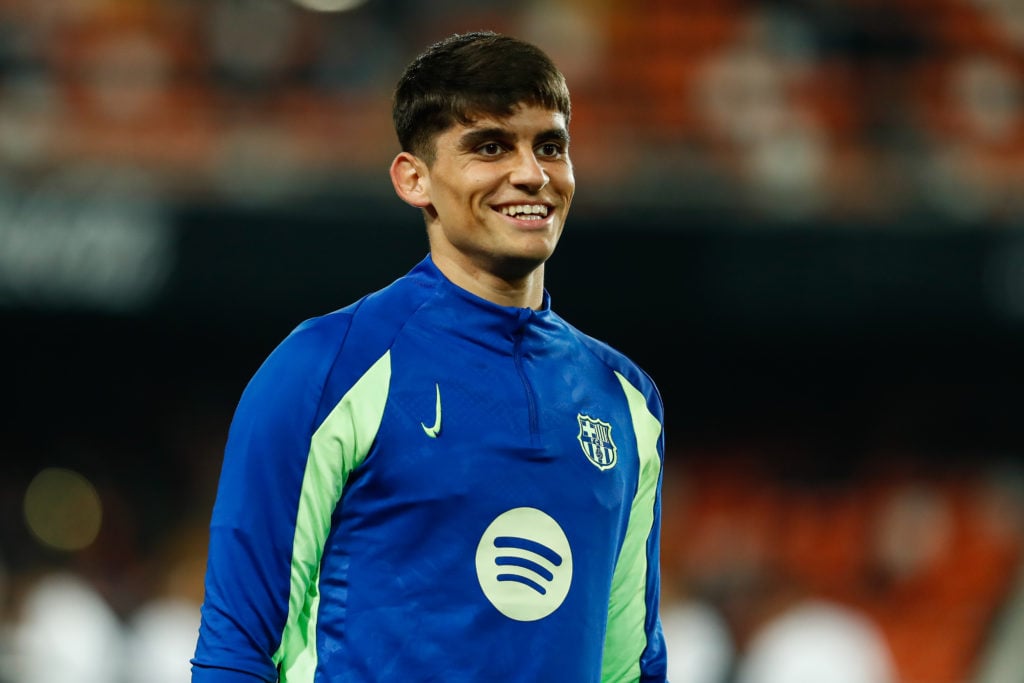 Gerard Martin smiles as he warms up for Barcelona.