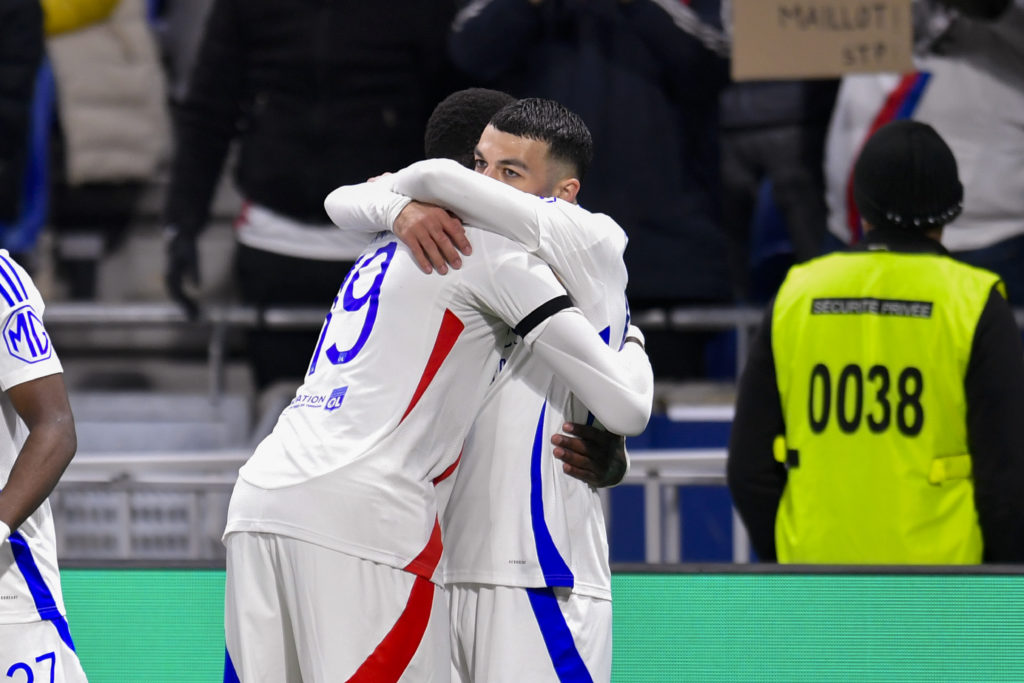 Georges Mikautadze hugs a Lyon teammate.