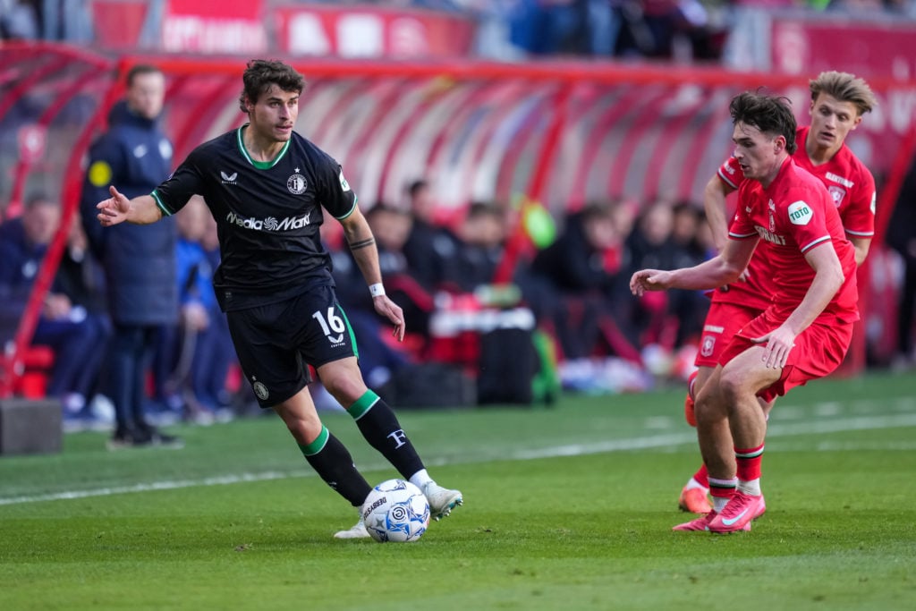 Hugo Bueno of Feyenoord and Taylor Booth of FC Twente during a Dutch Eredivisie match between FC Twente and Feyenoord.