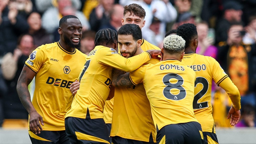 Wolves players celebrate a goal against Tottenham