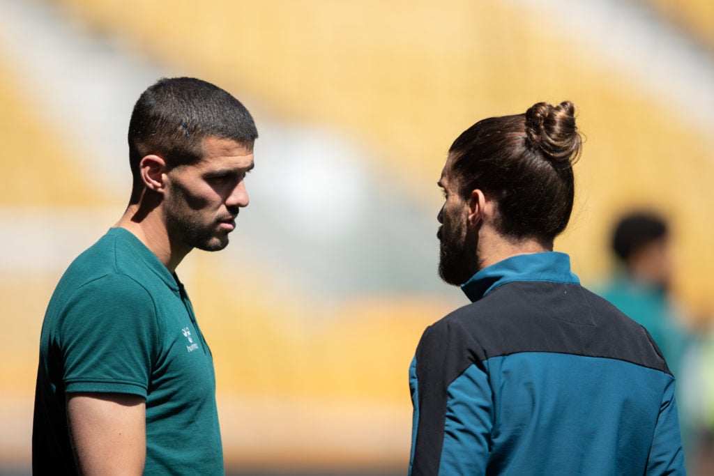 Conor Coady speaks to Ruben Neves.