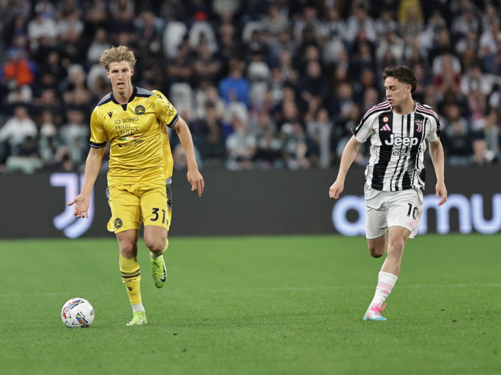 Thomas Kristensen carries the ball for Udinese.