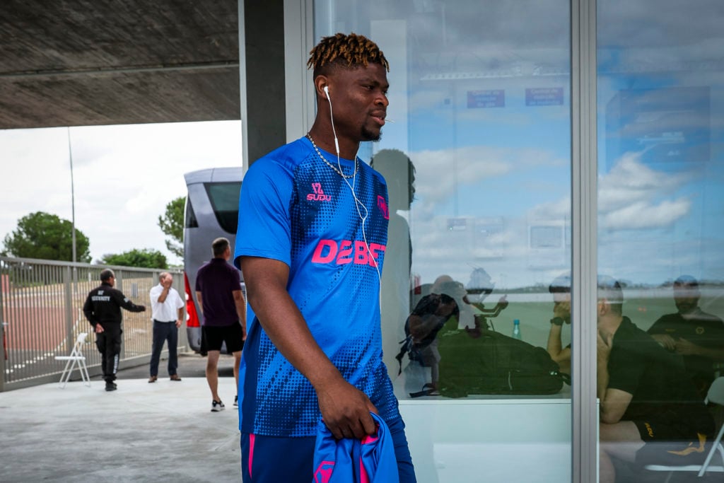 Emmanuel Agbadou listens to music during Wolves pre-season training camp.