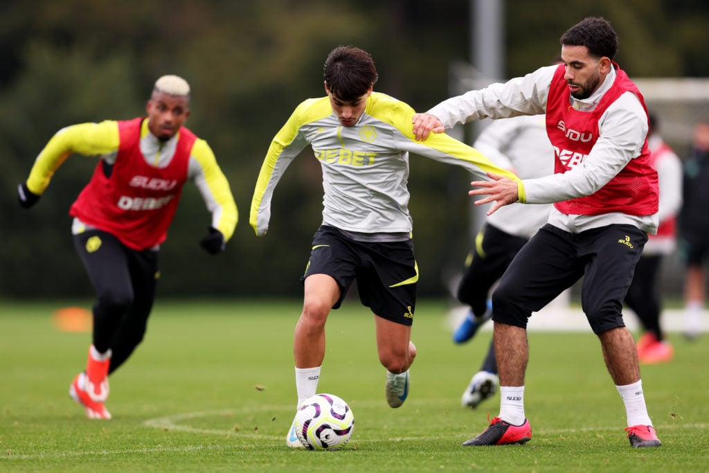Rodrigo Gomes is challenged by Rayan Ait-Nouri of Wolverhampton Wanderers during a Wolverhampton Wanderers Training Session