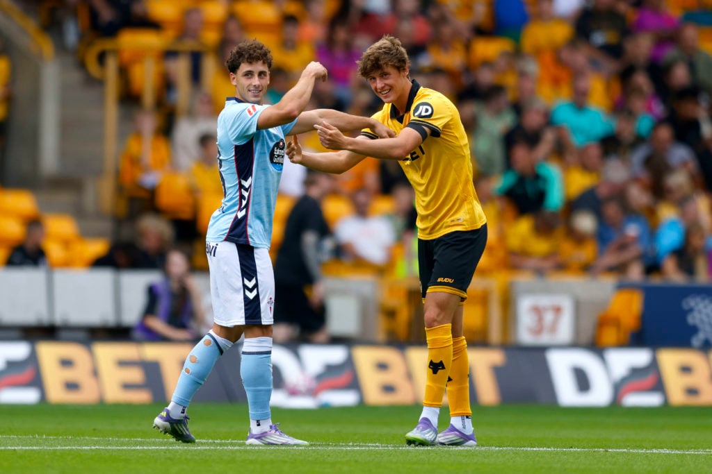 Former teammates at Celta Vigo Pablo Duran (l) and Fer Lopez of Wolverhampton Wanderers react