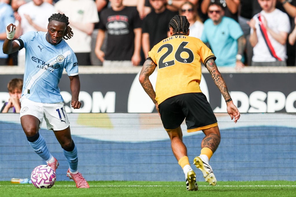 Ki-Jana Hoever up against Manchester City's Jeremy Doku during match at Molineux stadium