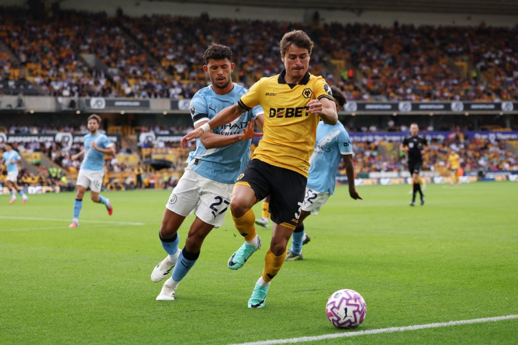 Matheus Nunes in action against Wolves battling against Hugo Bueno at Molineux Stadium