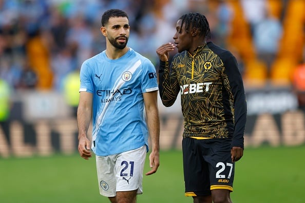 Rayan Ait-Nouri speaking to Wolves player Jean-Ricner Bellegarde during Wolves vs Manchester City