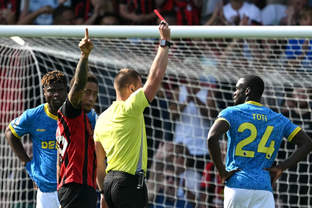 Wolverhampton Wanderers' Portuguese defender #24 Tote Gomes is shown a red card by Referee Thomas Bramall during the English Premier League