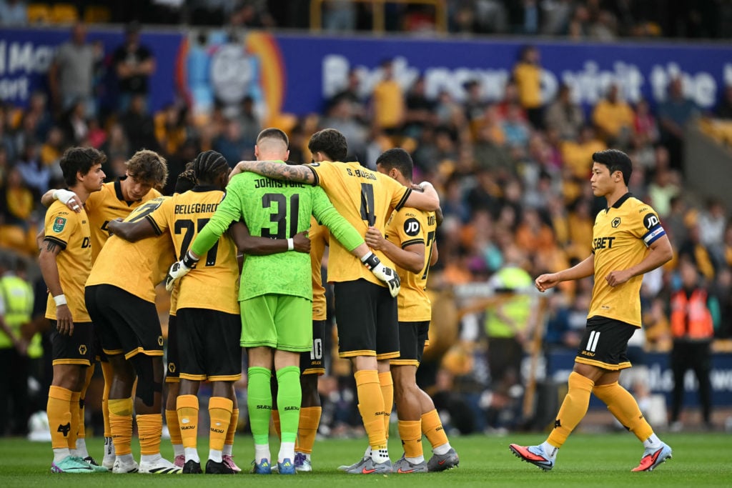 Wolves players in a huddle at Molineux.