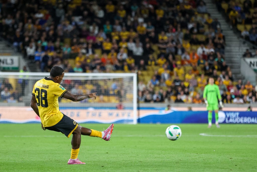 Jackson Tchatchoua crossing the ball for Wolves against West Ham United.