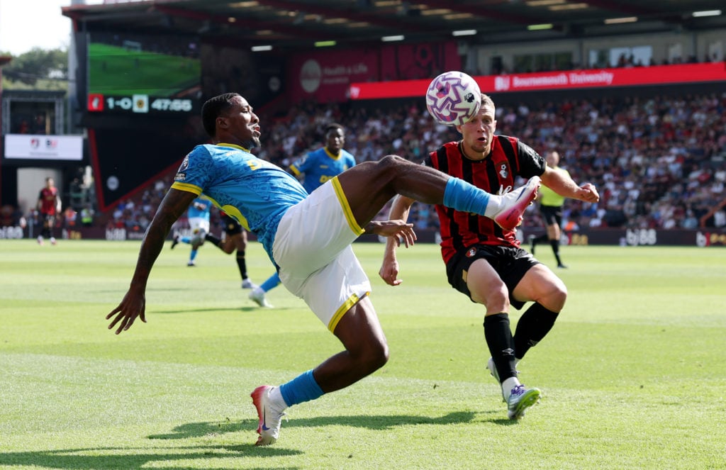 Jackson Tchatchoua fights for possession in Bournemouth vs Wolves.