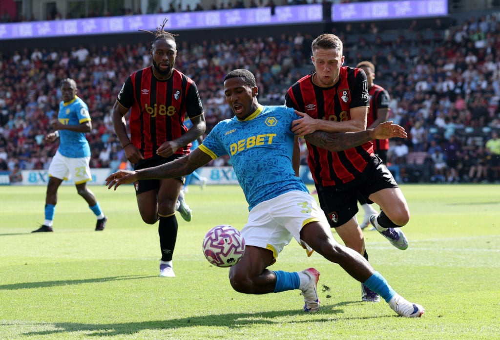 Jackson Tchatchoua of Wolverhampton Wanderers is challenged by Adrien Truffert of AFC Bournemouth during the Premier League match between Bournemouth and Wolverhampton Wanderers at Vitality Stadium