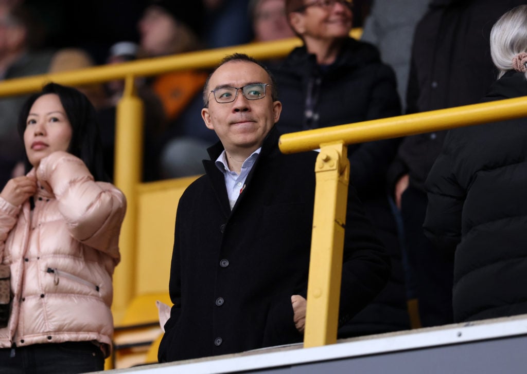 Chairman Jeff Shi looks on at Molineux.