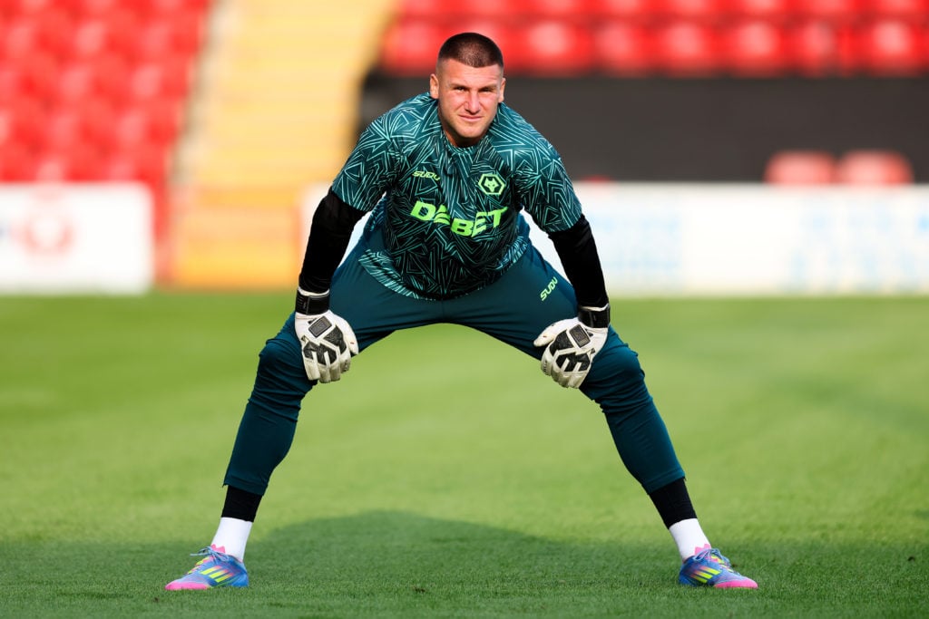 Sam Johnstone warming up for Wolves.