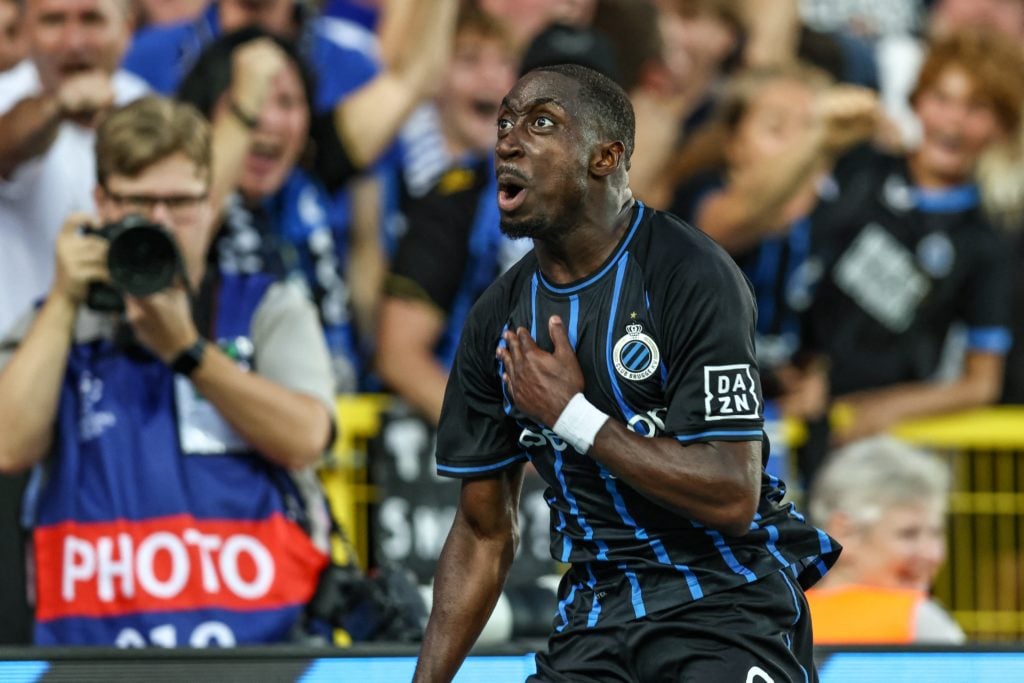 Carlos Forbs beats his chest after scoring for Club Brugge.