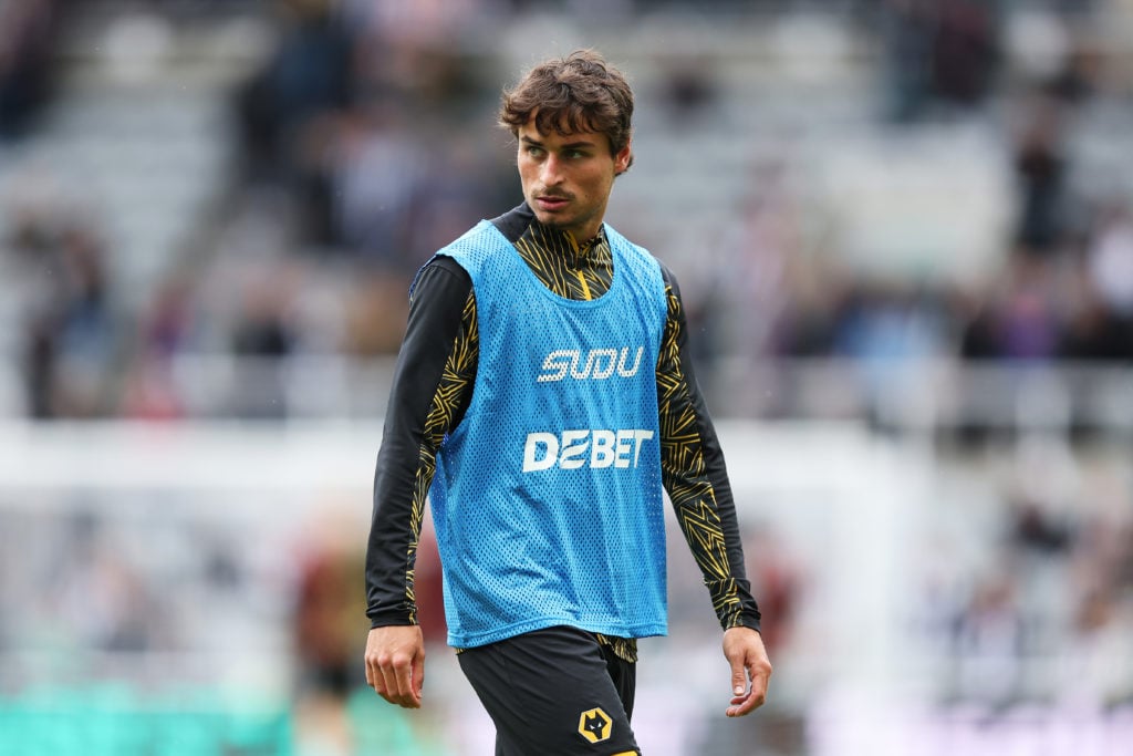 Hugo Bueno warming up for Wolves.