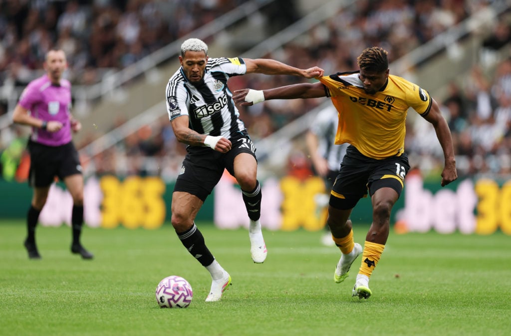 Emmanuel Agbadou jostles with Joelinton.