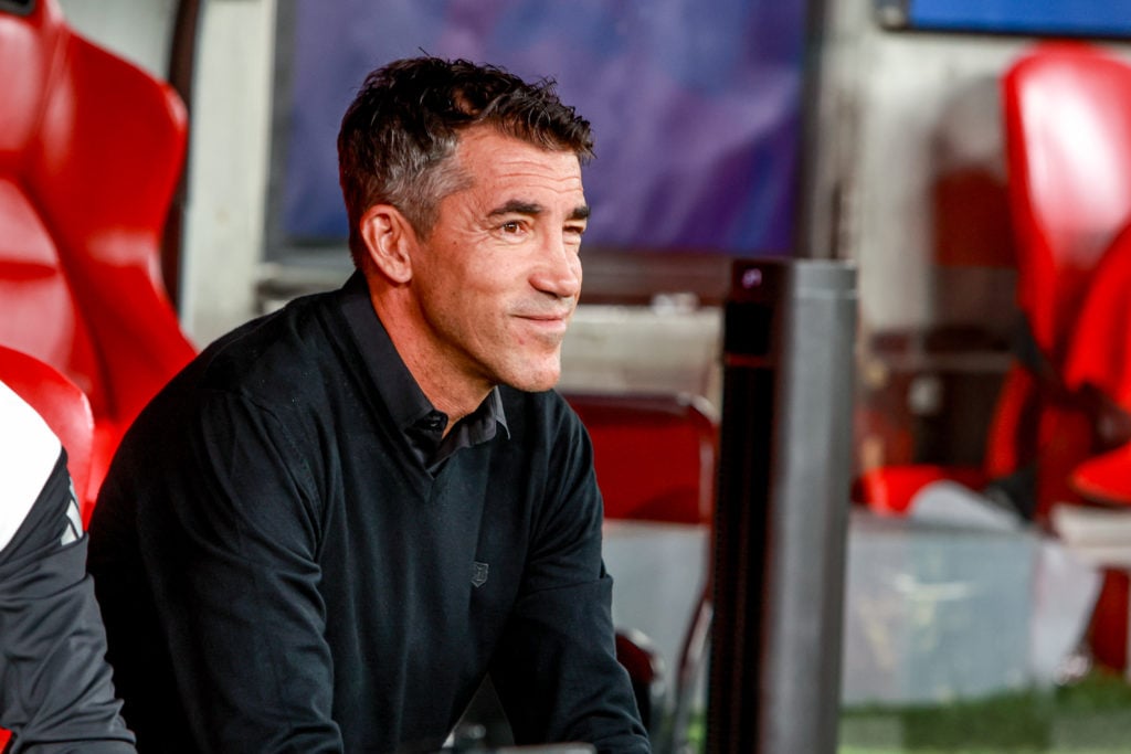 Bruno Lage winces while sitting on the bench.