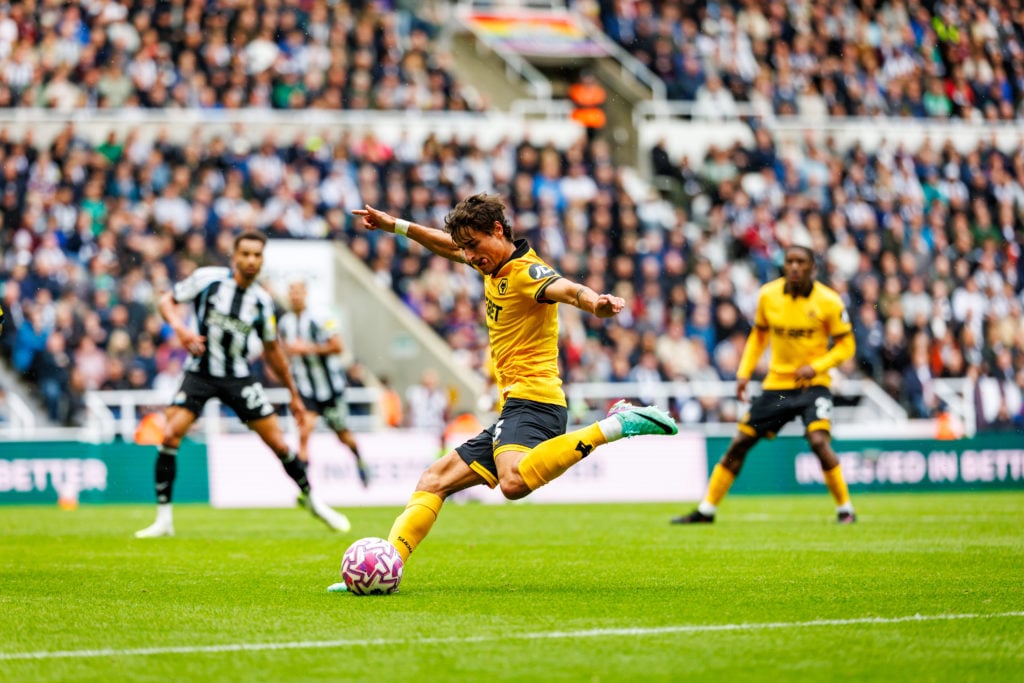 Hugo Bueno crossing the ball for Wolves.