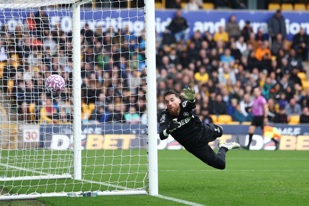 Jose Sa lets in a goal for Wolves.