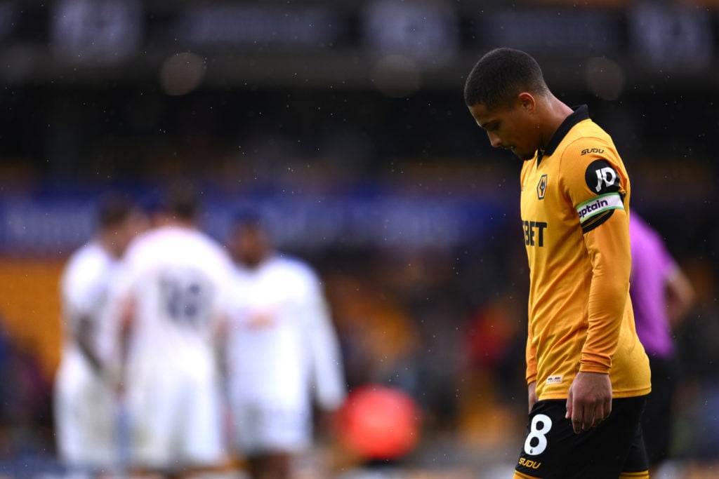 Joao Gomes looks dejected while playing for Wolves.