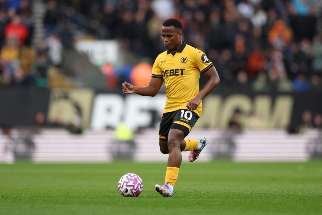 Jhon Arias plays a pass for Wolves.