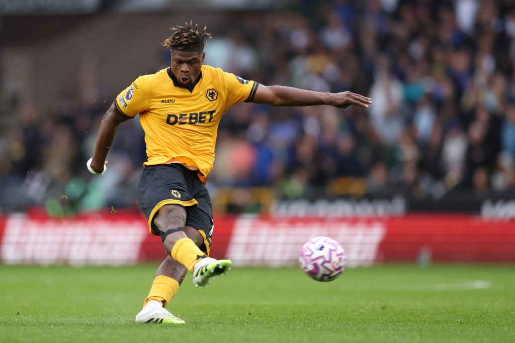 Emmanuel Agbadou plays a ball for Wolves.