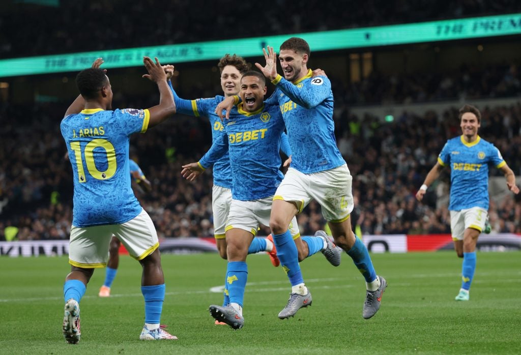 Wolves players celebrate after Santiago Bueno scores against Tottenham.