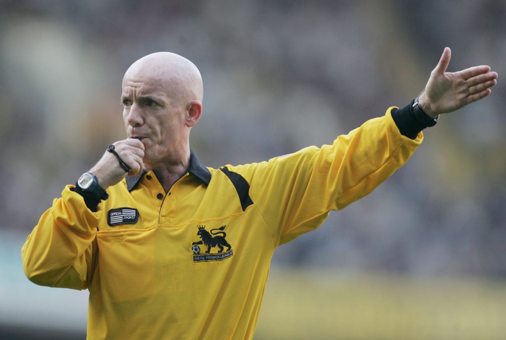 Dermot Gallagher working as a referee