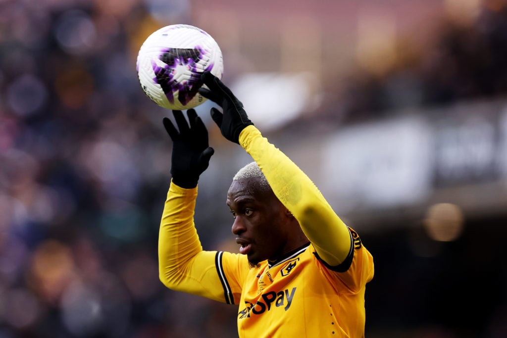 Toti Gomes takes a throw-in for Wolves.