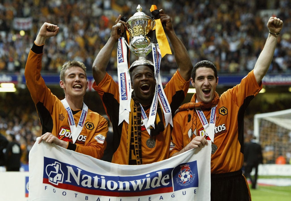 Kenny Miller, Nathan Blake and Mark Kennedy of Wolverhampton Wanderers celebrate with trophy