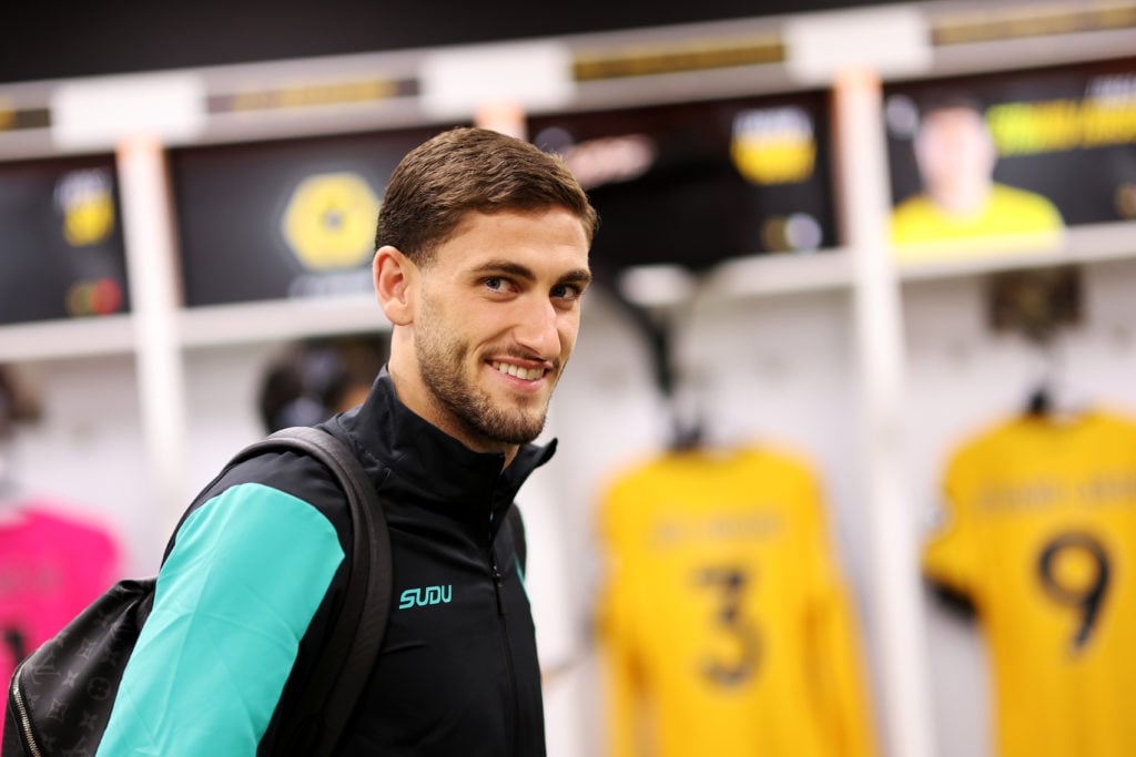 Santiago Bueno smiles in the Wolves dressing room.