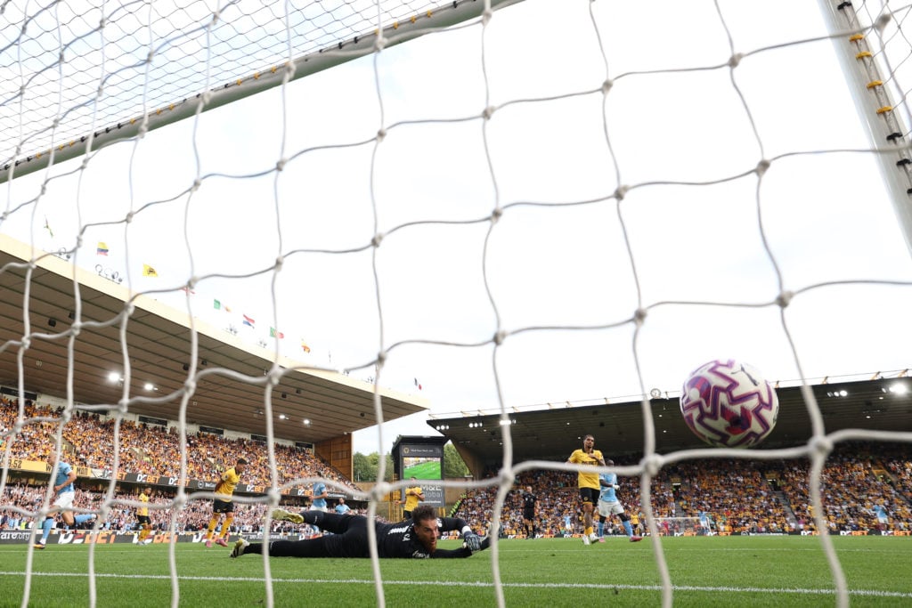 Erling Haaland scoring past Jose Sa