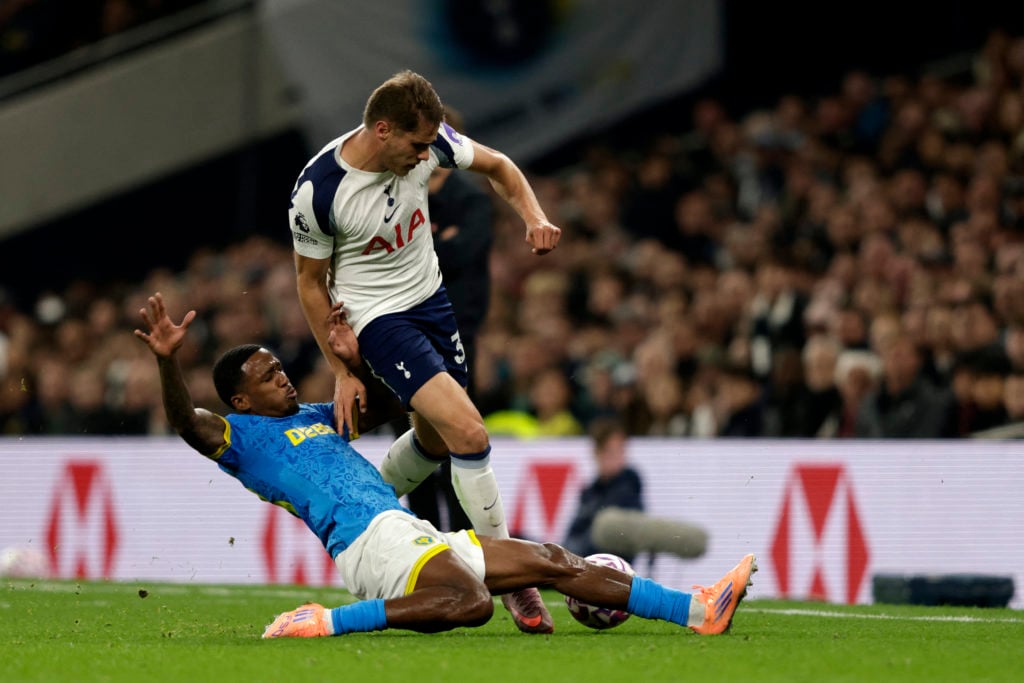Wolves defender Jackson Tchatchoua tackles Tottenham Hotspur's Dutch defender #37 Micky van de Ven